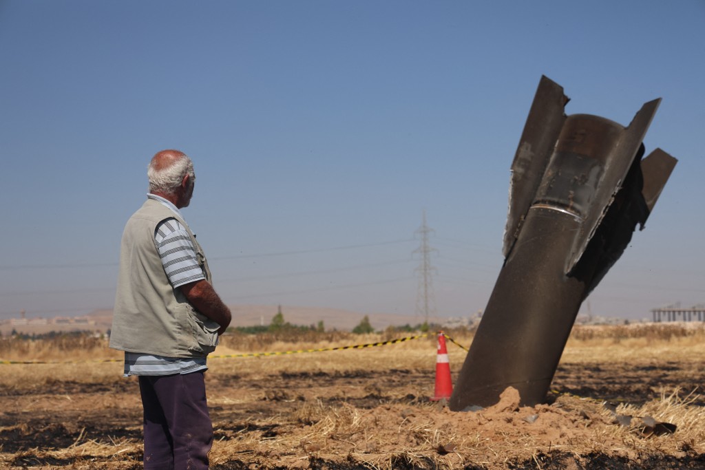Photo by BAKR ALKASEM / AFP A Syrian farmer looks at an Iranian missile that fell into an agricultural land in the area of Najha, in the countryside of the Syrian capital after being intercepted by Israeli air defense systems on June 8, 2026.