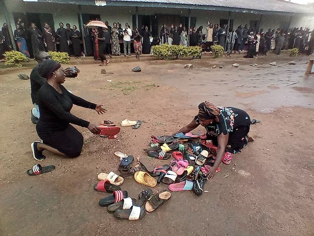 Parents of students abducted at Bethel Baptist High School pray for their safe return around discarded shoes left behind by the children, in Kaduna, Nigeria July 9, 2021. REUTERS/Bosan Yakusak /File Photo 