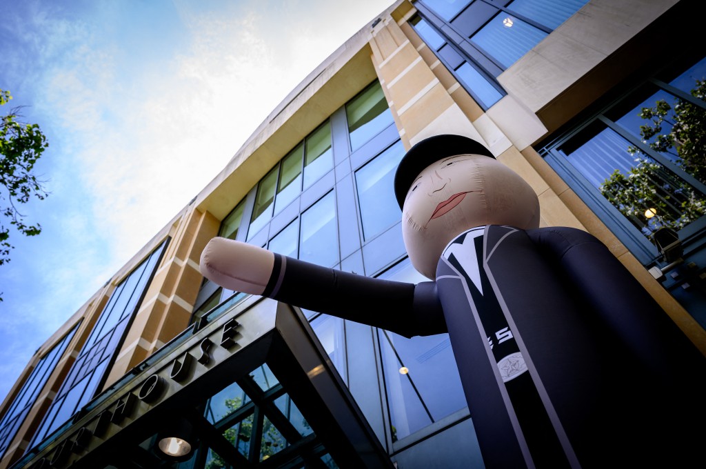 Photo by JOSH EDELSON / AFP  An Elon Musk inflatable makes a nazi salute outside the federal courthouse during proceedings in the trial of Elon Musk VS. OpenAI in Oakland, California, on May 12, 2026.