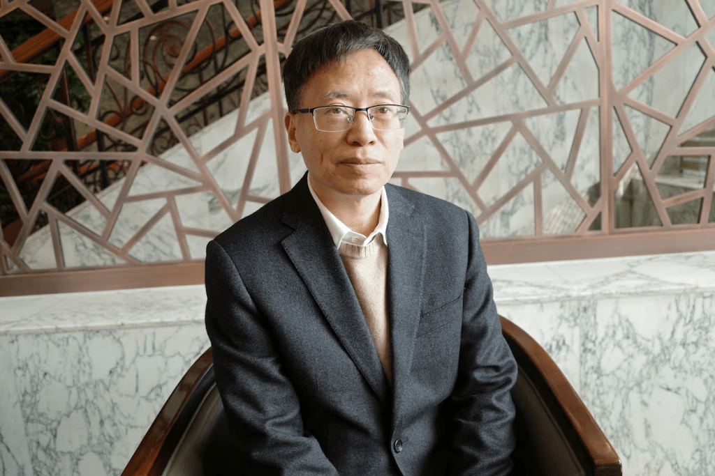 Brain-computer interface scientist and National People's Congress delegate Yao Dezhong poses for pictures during an interview with Reuters in Beijing, China March 7, 2026. REUTERS/Laurie Chen