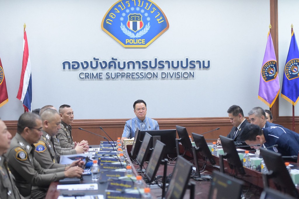 Photo by HANDOUT / ROYAL THAI GOVERNMENT / AFP  This handout photo taken and released on July 15, 2026 shows Thailand's Prime Minister and Interior Minister Anutin Charnvirakul (C) chairing a meeting on an investigation into a local government exam cheating scandal at the Central Investigation Bureau (CIB) in Bangkok.