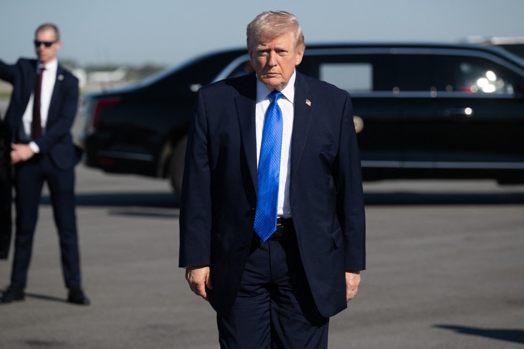 Photo by SAUL LOEB / AFP  US President Donald Trump walks to speak to reporters before boarding Air Force One at Palm Beach International Airport in West Palm Beach, Florida, on March 23, 2026.