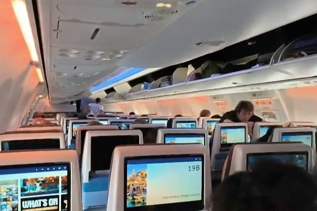 Photo by - / AFPTV / AFP This screengrab taken from a handout video footage via AFPTV on September 30, 2026 shows passengers inside the rerouted flydubai flight FZ 1073, ahead of its departure to Tel Aviv from Saudi Arabia’s Tabuk airport.