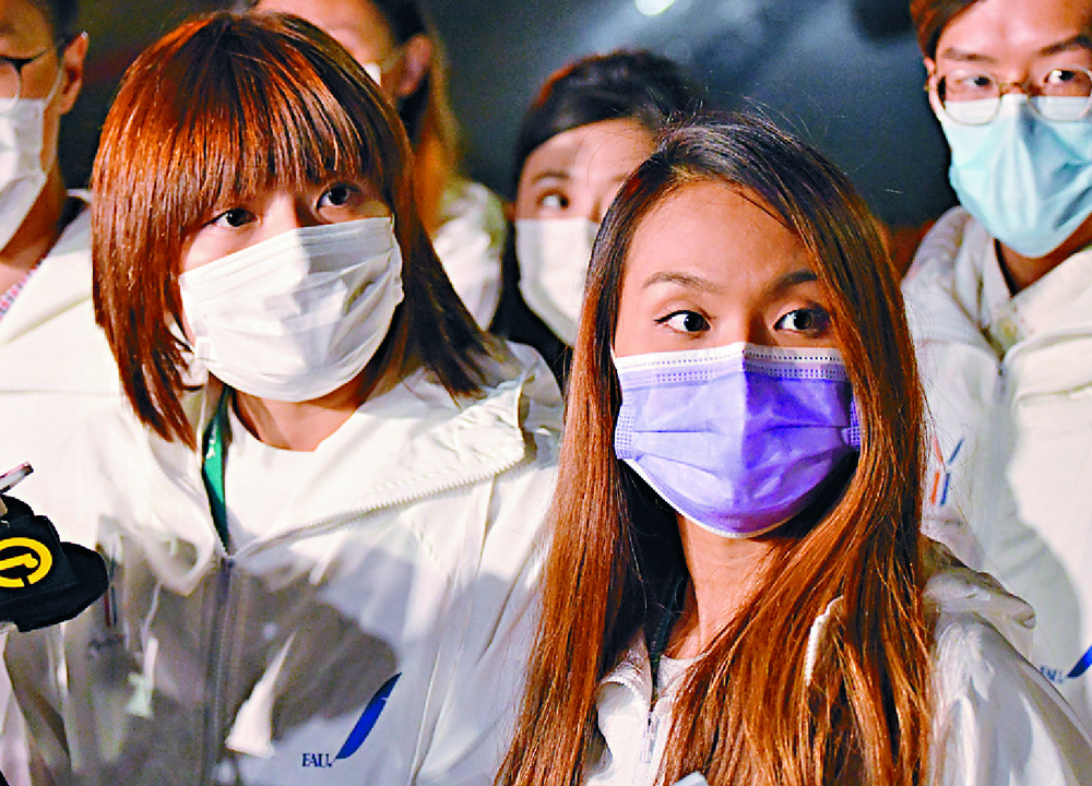 Cathay Pacific Flight Attendants Union's Zuki Wong, far left, and Amber Suen address the media following a meeting of 360 angry members. Sing Tao Cathay Pacific Flight Attendants Union's Zuki Wong, far left, and Amber Suen address the media following a meeting of 360 angry members. Sing Tao