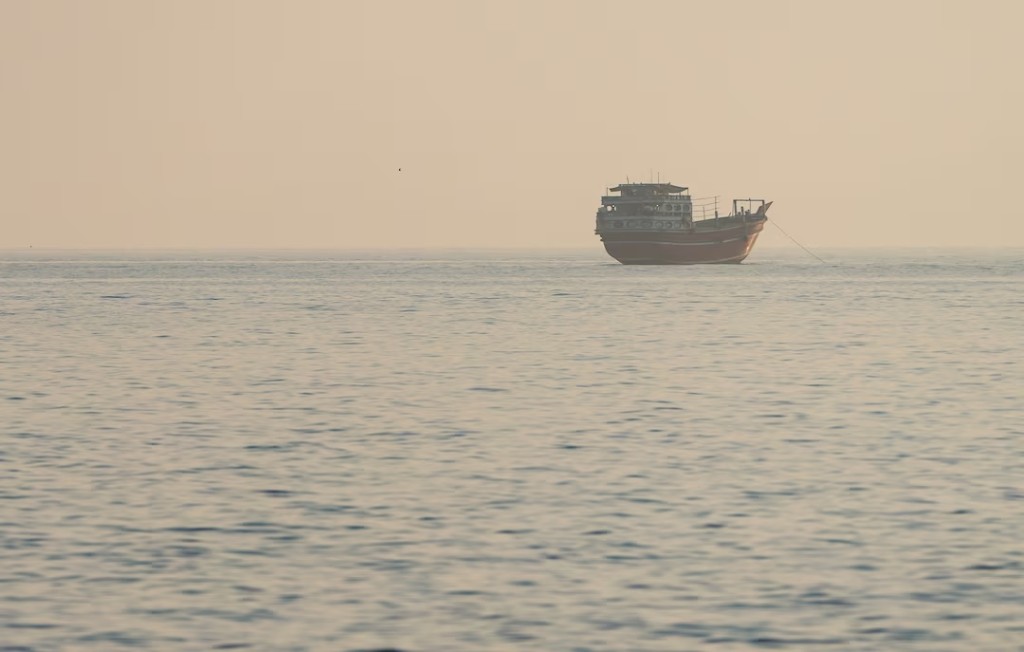 A vessel at the Strait of Hormuz, as seen from Musandam, Oman, July 28, 2026. REUTERS/Stringer 