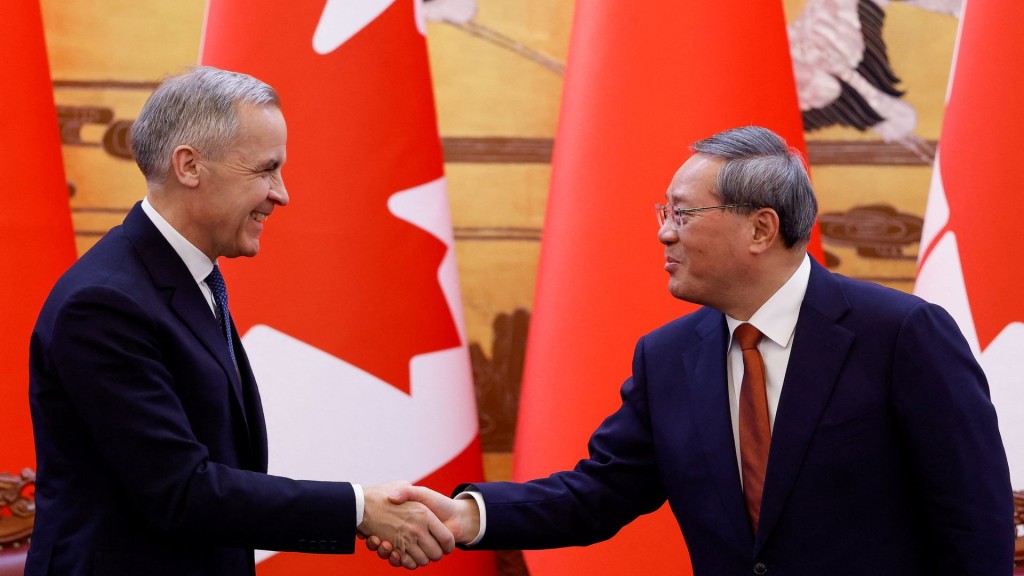 Canada's Prime Minister Mark Carney shakes hands with China's Premier Li Qiang. Reuters