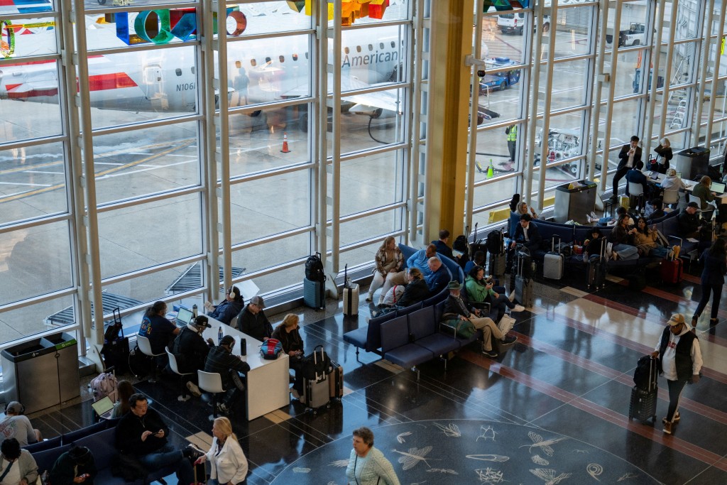 Travelers wait for their flights at Ronald Reagan Washington National Airport, more than a month into the ongoing U.S. government shutdown, in Arlington, Virginia, U.S., November 9, 2025. (Reuters)