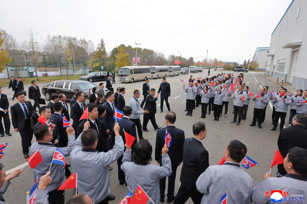 North Korean leader Kim Jong Un visiting a bus factory in Dandong, China's Liaoning province. (AFP)