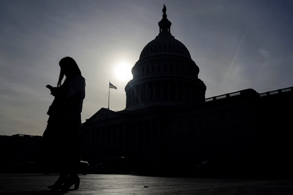A person uses a mobile phone with the U.S. Capitol building in the background on Capitol Hill in Washington, U.S., November 13, 2024. REUTERS/Nathan Howard/File Photo A person uses a mobile phone with the U.S. Capitol building in the background on Capitol Hill in Washington, U.S., November 13, 2024. REUTERS/Nathan Howard/File Photo