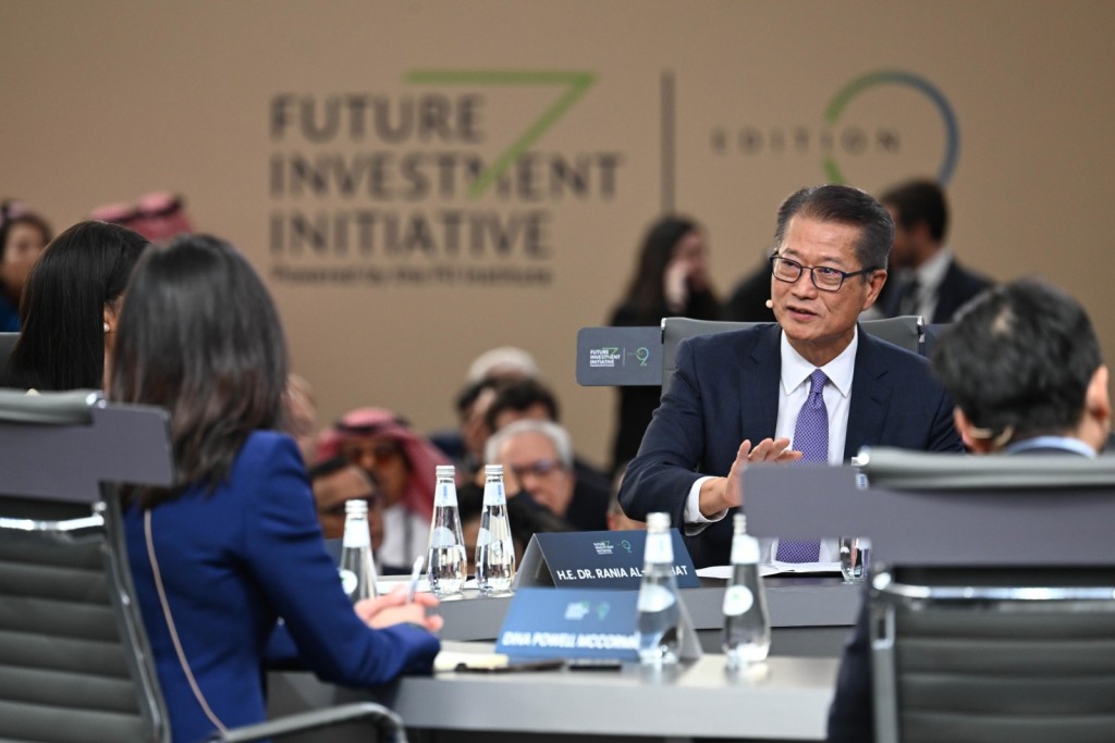 Photo shows Paul Chan attending the Future Investment Initiative and speaking at the thematic discussion session.