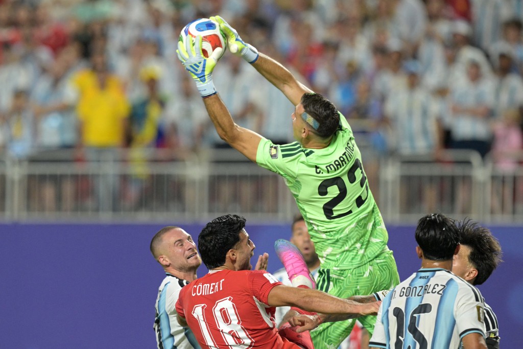 Argentina's goalkeeper #23 Emiliano Martinez makes a save during the 2026 World Cup football tournament quarter-final match (AFP)