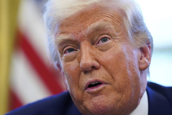 President Donald Trump speaks as he signs executive orders in the Oval Office of the White House on April 9, 2025, in Washington. (Pool via AP)