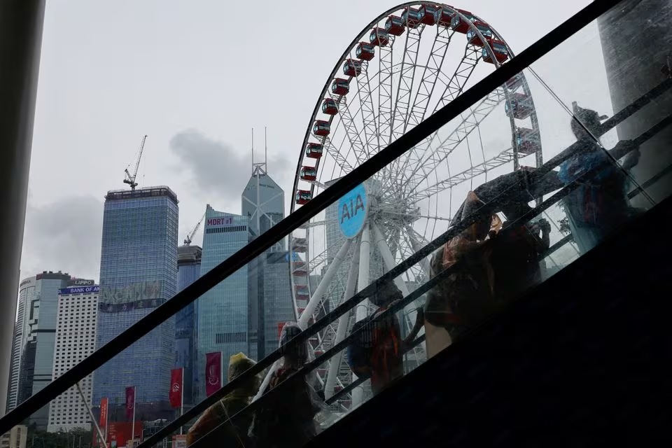 Chinese tourists walk in front of Central financial district, in Hong Kong, China, August 11, 2023. (Reuters) Chinese tourists walk in front of Central financial district, in Hong Kong, China, August 11, 2023. (Reuters)