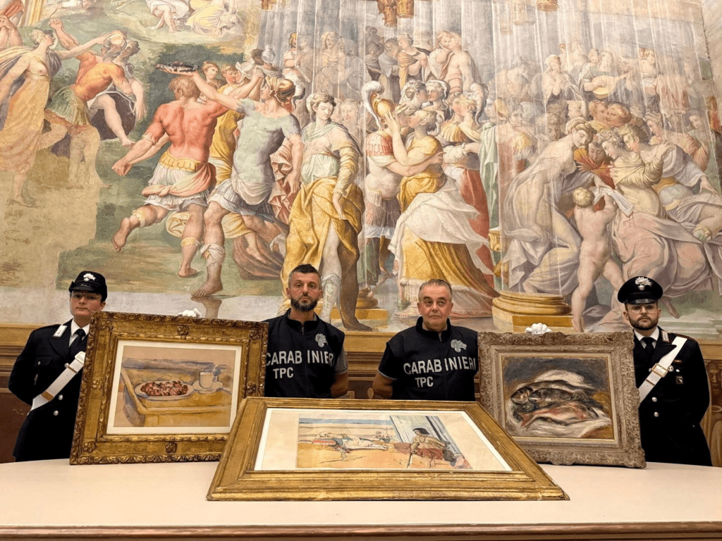 Carabinieri officers pose with paintings by Paul Cezanne, Henri Matisse and Pierre-Auguste Renoir recovered after they were stolen from the Magnani Rocca Foundation in Mamiano, Italy, in this handout image released on August 14, 2026. Carabinieri/Handout via REUTERS/File Photo