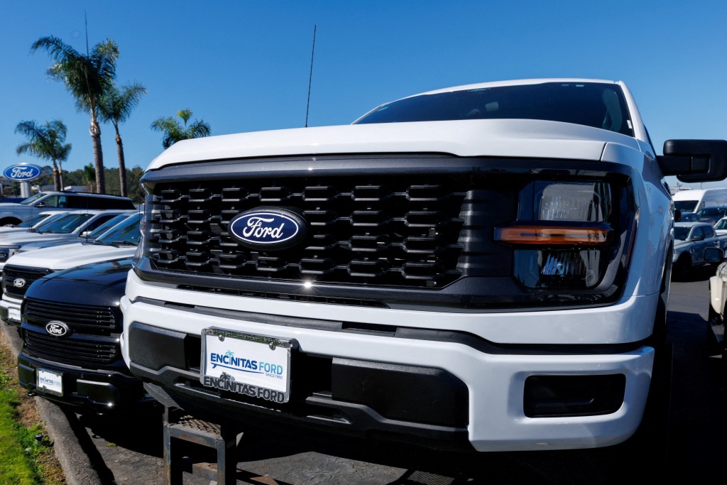 FILE PHOTO: Ford F-150 pickup trucks for sale in Encinitas, California, U.S. October 20, 2025. REUTERS/Mike Blake/File Photo