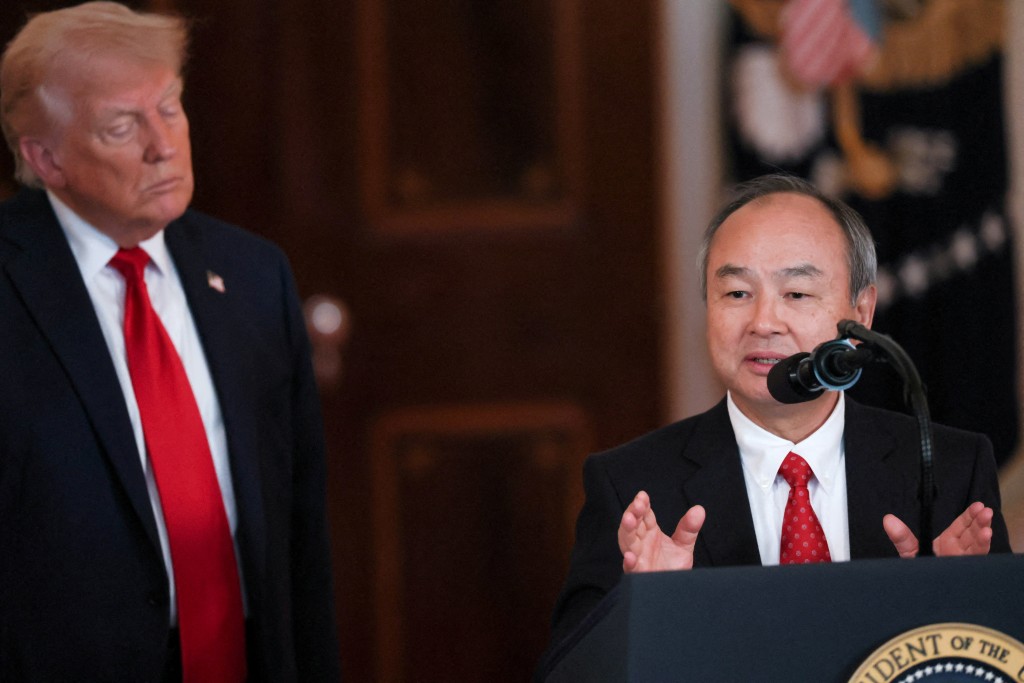 SoftBank CEO Masayoshi Son delivers remarks next to U.S. President Donald Trump at an 'Investing in America' event in Washington, D.C., U.S., April 30, 2025. REUTERS/Leah Millis/File Photo