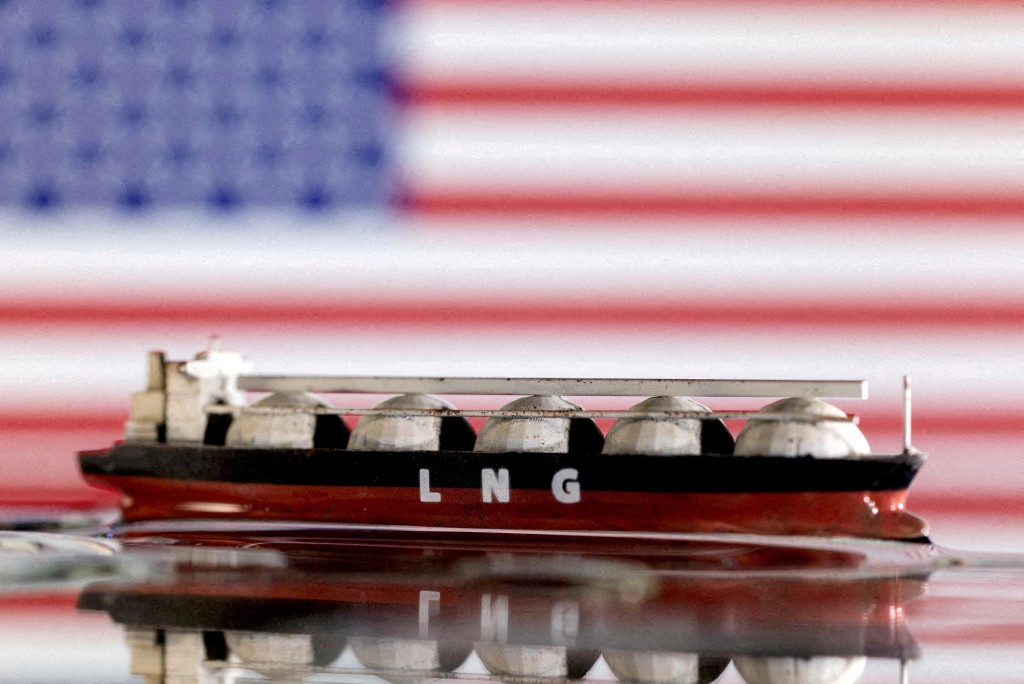 Model of LNG tanker is seen in front of the U.S. flag in this illustration taken May 19, 2022. (Reuters)