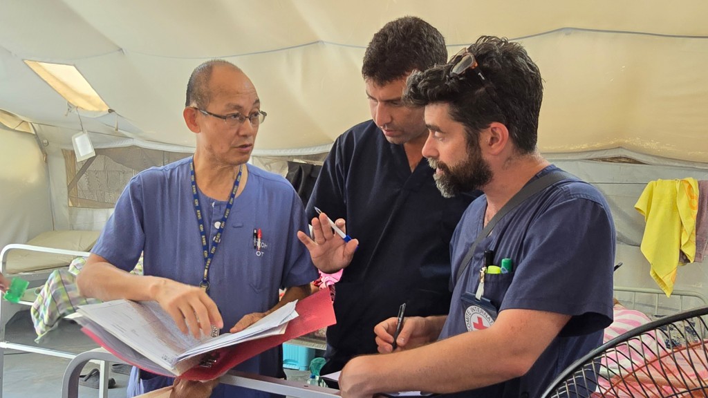 Dr Au Yiu-kai (left), a volunteer doctor of Hong Kong Red Cross, has made three trips to Gaza, serving as a surgeon. Edit caption