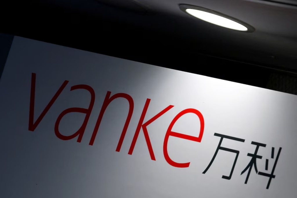 The company logo of China Vanke is displayed at a news conference announcing the property developer's interim results in Hong Kong, China August 22, 2016. REUTERS