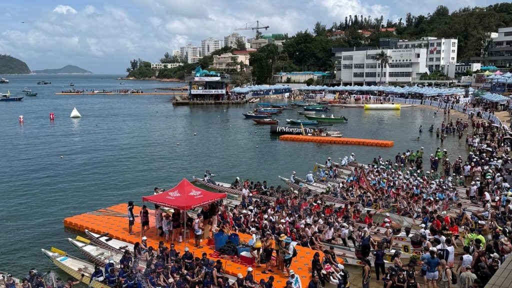 Dragon boat racers at Stanley Beach enjoy clear skies on festival day.