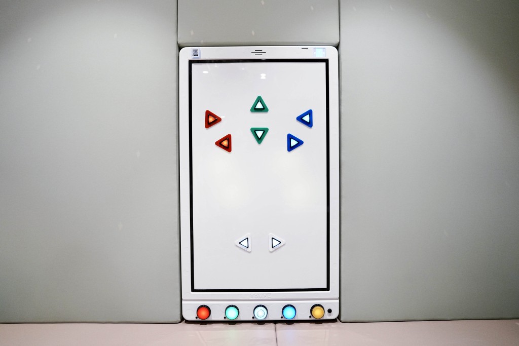 A color command wall panel is designed for interactive sensory experience. 