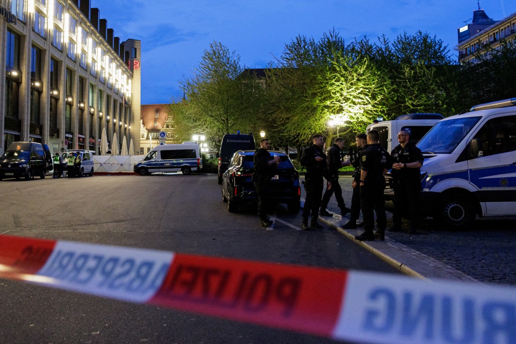 Photo by JENS SCHLUETER / AFP  Police investigators work at the scene where a car ploughed into people on a street leaving at least two dead and several injured, in the city centre in Leipzig, eastern Germany on May 4, 2026.