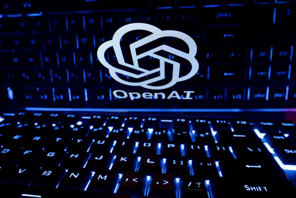 A keyboard is placed in front of a displayed OpenAI logo in this illustration taken February 21, 2023. REUTERS