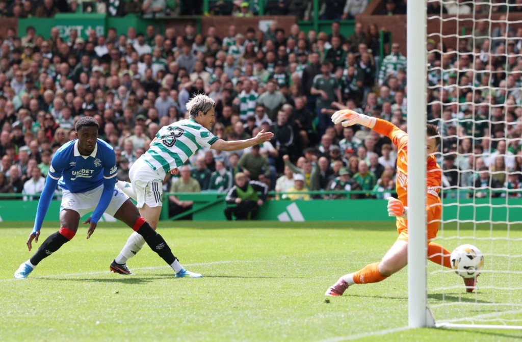 Daizen Maeda scores Celtic's second goal past Rangers 'keeper Jack Butland. REUTERS 