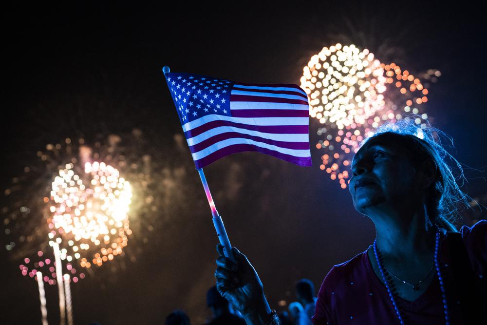 Spectators watch as fireworks are launched over the East River and the Empire State Building during the Macy's 4th of July Fireworks show, Sunday, July 4, 2021, in the Queens borough of the city of New York. Spectators watch as fireworks are launched over the East River and the Empire State Building during the Macy's 4th of July Fireworks show, Sunday, July 4, 2021, in the Queens borough of the city of New York.