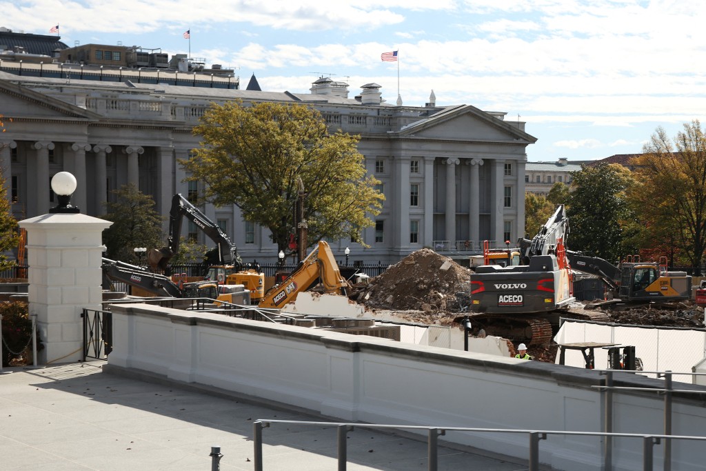 Photo by SAMUEL CORUM / GETTY IMAGES NORTH AMERICA / GETTY IMAGES VIA AFP  Excavators work to clear debris after the East Wing of the White House was demolished earlier this week, October 31, 2025 in Washington, DC.