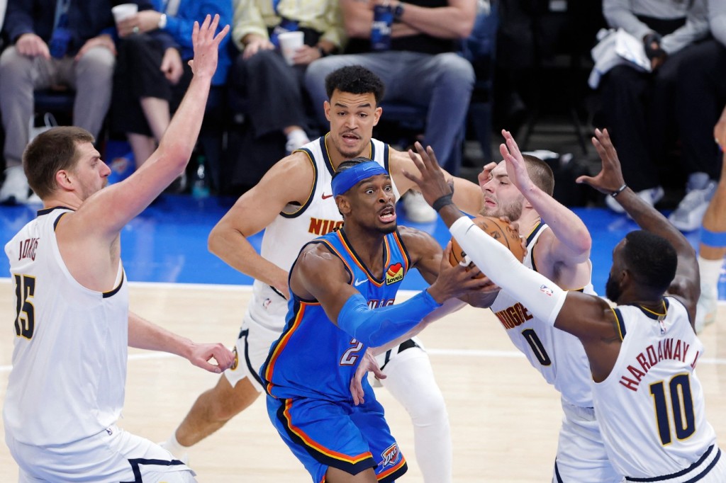 Shai Gilgeous-Alexander challenges the Denver Nuggets' defense. REUTERS