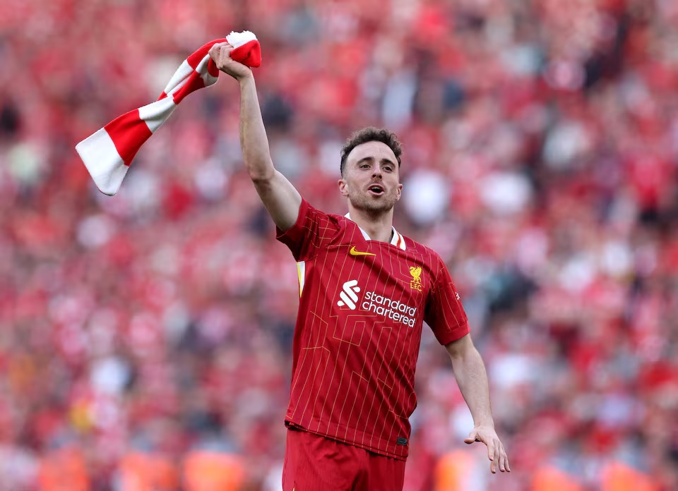 Soccer Football - Premier League - Liverpool v Tottenham Hotspur - Anfield, Liverpool, Britain - April 27, 2025 Liverpool's Diogo Jota celebrates after winning the Premier League REUTERS/Phil Noble/File Photo