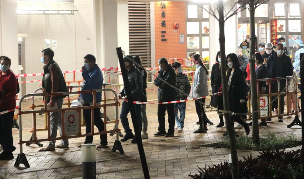 Residents of Hung Lok House line up to take Covid test. Residents of Hung Lok House line up to take Covid test.
