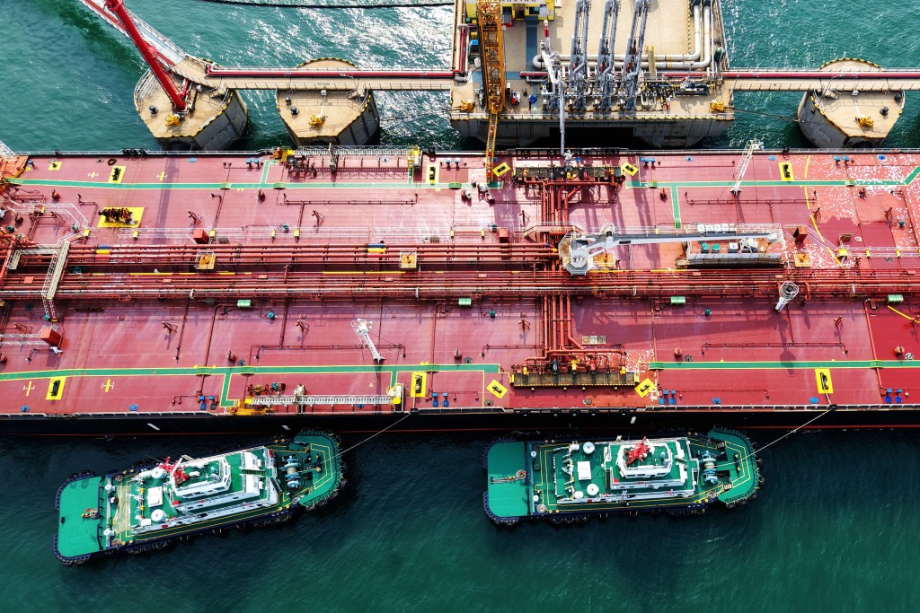 A crude oil tanker unloads at the oil terminal of the port in Qingdao, in China’s eastern Shandong province on April 28, 2026. (Photo by CN-STR / AFP) / CHINA OUT