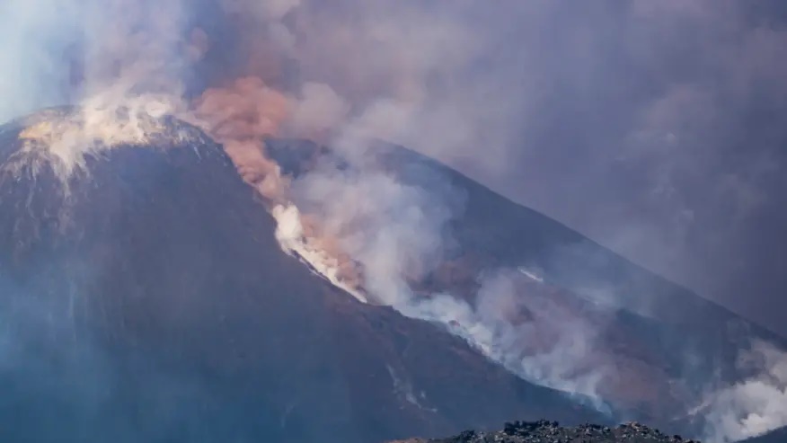 Smoke billows from Mount Etna volcano, Italy, Monday, June 2, 2025. (AP Photo/Giuseppe Distefano)