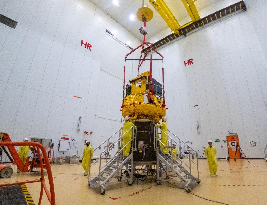 Photo by M. PEDOUSSAUT / ESA / AFP This photograph shows the Smile spacecraft (gold) fixed to a Vega-C rocket adaptor (black cone) on 25 March 2026, in Kourou, French Guiana, in preparation for liftoff from Europe’s Spaceport.