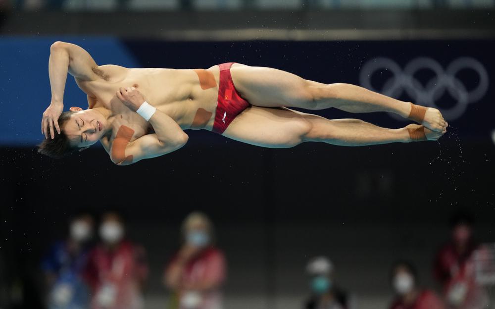 Wang Zongyuan of China competes in men's diving 3m springboard semifinal at the Tokyo Aquatics Centre at the 2020 Summer Olympics, Tuesday, August 3, 2021, in Tokyo, Japan. Wang Zongyuan of China competes in men's diving 3m springboard semifinal at the Tokyo Aquatics Centre at the 2020 Summer Olympics, Tuesday, August 3, 2021, in Tokyo, Japan.