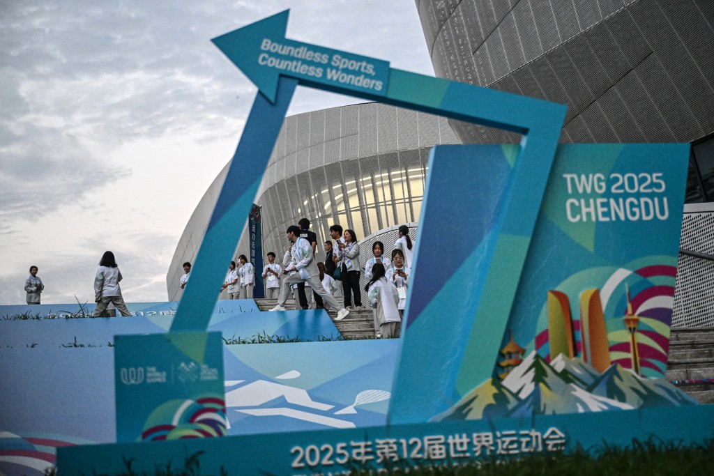Volunteers are seen on the stairs during the 2025 World Games at the Hi-Tech Zone Sports Centre in Chengdu, in China's southwestern Sichuan province on August 11, 2025. (Photo by Jade GAO / AFP)
