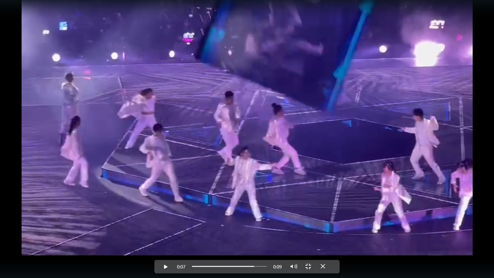 The large visual display screen tearing loose from its tether, falling to the ground and crushing two dancers below. (Sing Tao file)