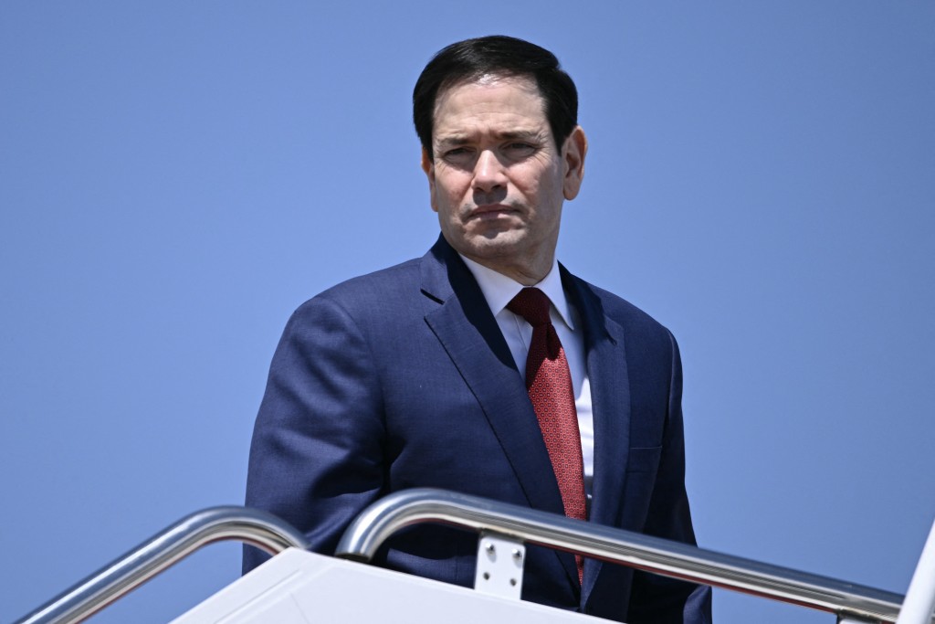 Photo by BRENDAN SMIALOWSKI / AFP  US Secretary of State Marco Rubio boards Air Force One at Joint Base Andrews, Maryland, on May 12, 2026 as he departs for a 3-day state visit to China.