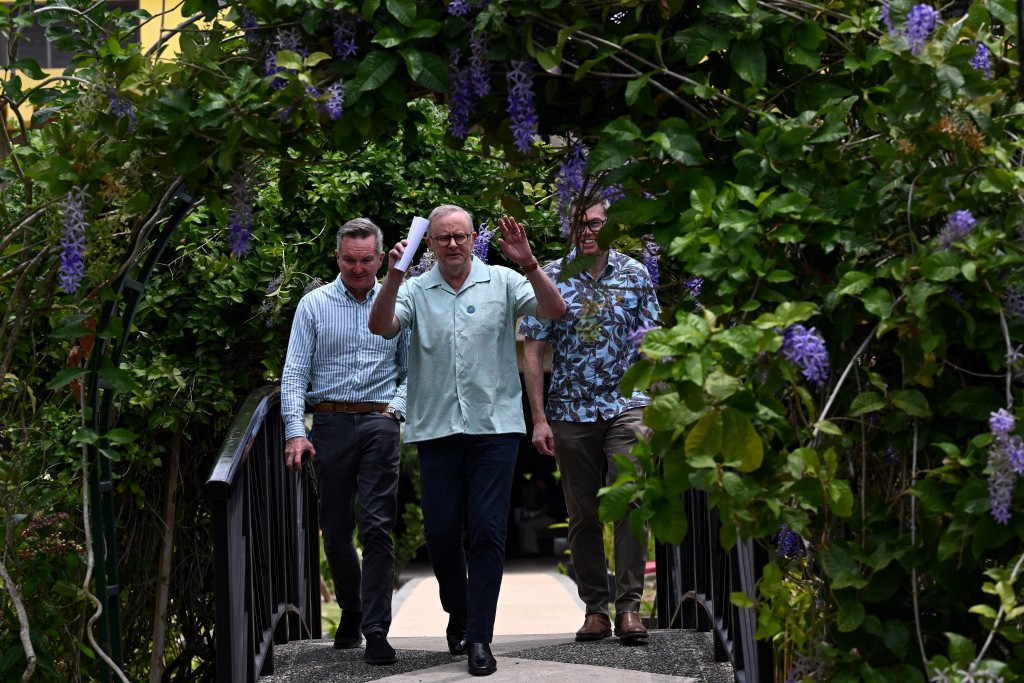 Australia's Prime Minister Anthony Albanese (C) walks with Australia's Minister for Climate Change and Energy Chris Bowen (L) and the Minister for Defence Industry Pat Conroy for a press conference at the 55th Pacific Islands Forum Leaders Meeting in the capital city of Koror in Palau on September 2, 2026. (Photo by SAEED KHAN / AFP)