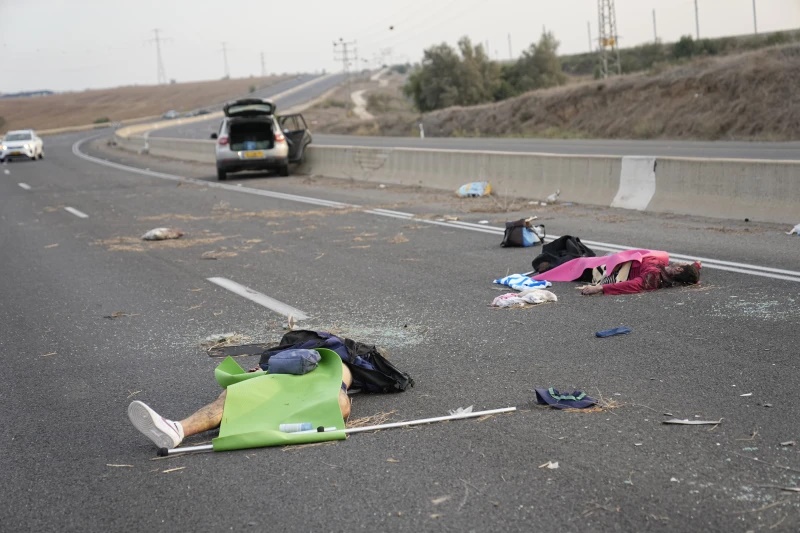 Israelis killed by Hamas militants lie on the road near Sderot, Israel, Oct. 7, 2023. (AP Photo/Ohad Zwigenberg, File) Israelis killed by Hamas militants lie on the road near Sderot, Israel, Oct. 7, 2023. (AP Photo/Ohad Zwigenberg, File)