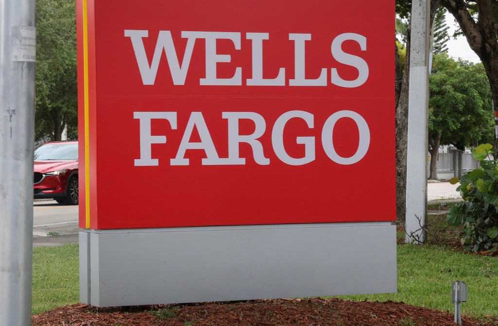 A Wells Fargo sign is seen outside of the bank as the company's quarterly earnings beat expectations on July 15, 2025 in Miami, Florida. Reuters