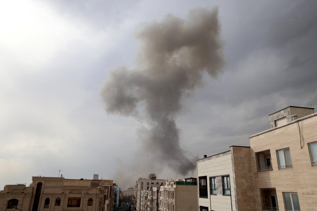 A plume of smoke acends after a military strike on the capital Tehran on March 2, 2026. (AFP)