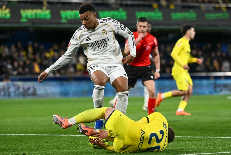 Kylian Mbappe controls the ball against Villarreal defender Pau Navarro. AFP 
