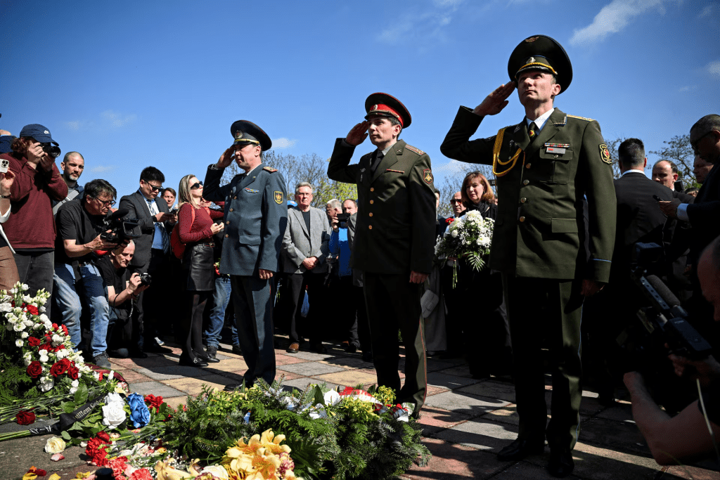 Belarusian Colonel Ales Pashkevich salutes, with fellow Russian and Kazakh colonels, as they lay flowers, at a commemoration of the Battle of the Seelow Heights to mark the 80th anniversary of the end of World War Two, in Seelow, Germany April 16, 2025. REUTERS/Annegret Hilse