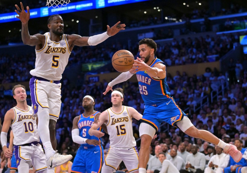 Ajay Mitchell vies with the Lakers' Deandre Ayton underneath the basket. REUTERS 