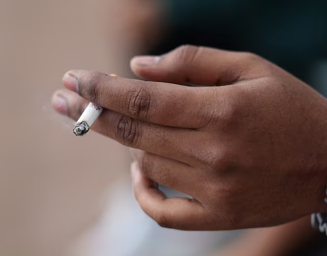 A man holds his cigarette as he smokes in London, Britain, April 11, 2024. REUTERS/Isabel Infantes/File Photo A man holds his cigarette as he smokes in London, Britain, April 11, 2024. REUTERS/Isabel Infantes/File Photo