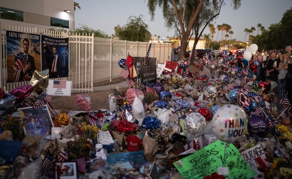 People pay respect to right-wing activist and Turning Point USA founder Charlie Kirk at a makeshift memorial set up outside of their headquarters in Phoenix, Arizona, on September 20, 2025. (AFP)