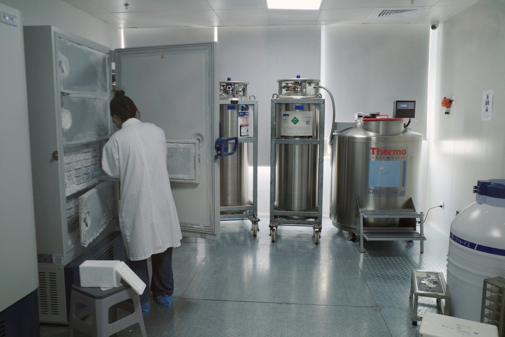 A lab technician retrieves biological samples from an ultra-low-temperature deep freezer at Insilico Medicine's research and development laboratory, in Shanghai, China, July 20, 2026. REUTERS